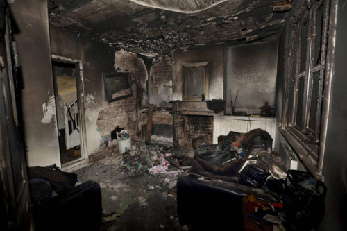 Burnt fireplace and living room