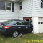 Car impacting and damaging house